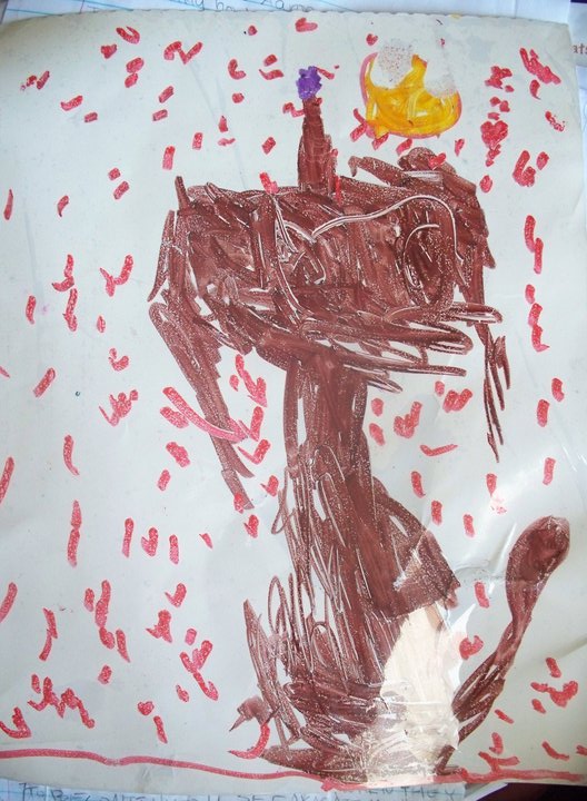 A badly-drawn wolf howling at the moon. It is drawn in marker, clearly done by a child.
